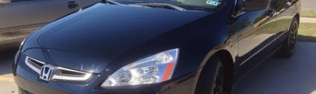 Repaired car front end with a clean, glossy finish after collision work
