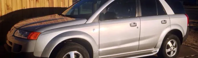 Clean side profile of a repaired SUV at the body shop